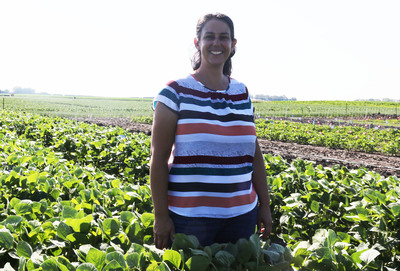 Amanda De Souza in a field of soybeans