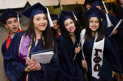 Latina students in caps and gowns