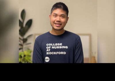 Asian student with UIC College of Medicine Rockford shirt
