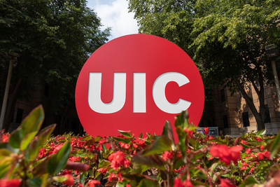 UIC circle logo statue on campus