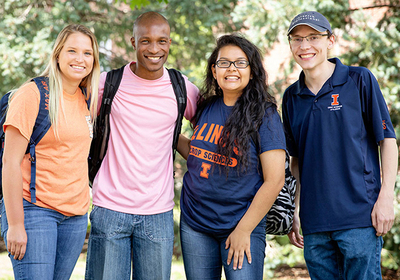 four smiling UIUC students