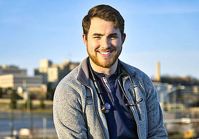 Male medical student with Peoria in backdrop
