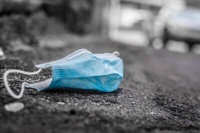surgical mask on pavement