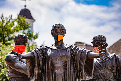 Masked Alma Mater statue