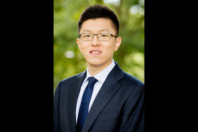 Asian male in suit with glasses